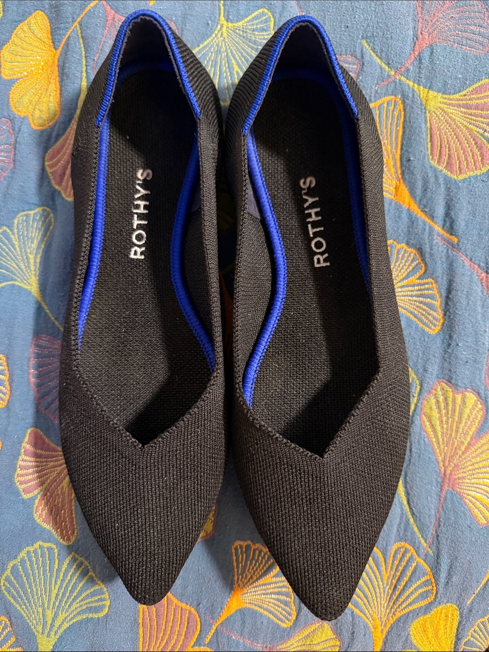 Rothy's Black Pointed Flats with Blue Trim
